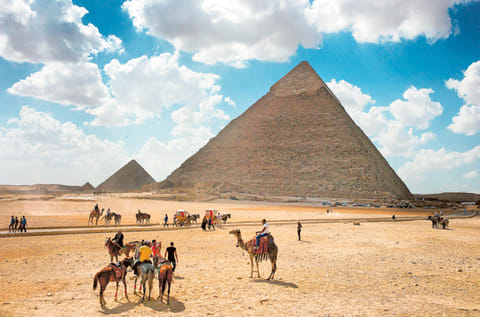 Tourists walk outside the Khafre Pyramid, Cairo. The pandemic has hit tourism in oil importing Mena countries so hard that there has been a deep contraction in the contribution of the sector to these economies.