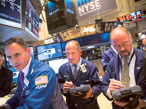 Global stocks, oil calm post massive sell-off