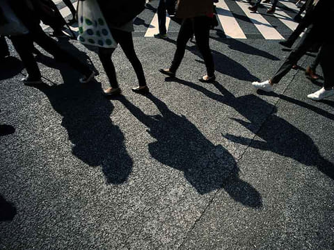 Shadows of pedestrians on a busy scramble crossing. Picture for illustrative purposes only. 