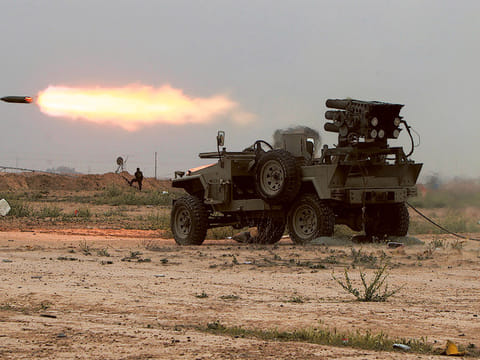 Picture for illustrative purposes only. Iraqi fighters of the government-controlled Popular Mobilisation units launch rockets towards Daesh group's fighters holed up in the centre of the city of Tikrit during a military operation to retake the city led from its western outskirt. 