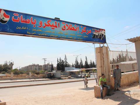 Aleppo bus depot is bridge between 2 worlds