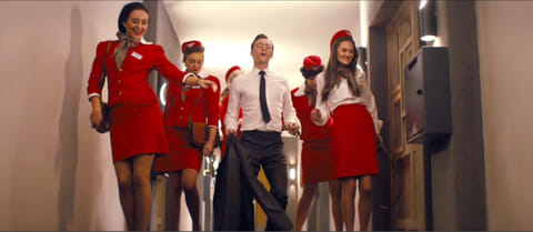 Tom Hiddleston dances through a retro hellscape in the trailer for ‘High-Rise’