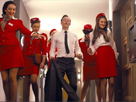 Tom Hiddleston dances through a retro hellscape in the trailer for ‘High-Rise’