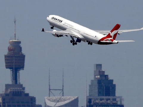 A Qantas Airways Airbus A330-300 jet takes off from Sydney International Airport.
