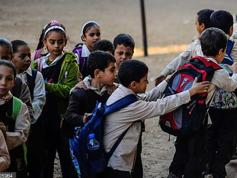 Egyptian students go to their classes at a primary school in Baragil neighborhood of Giza, Egypt. 