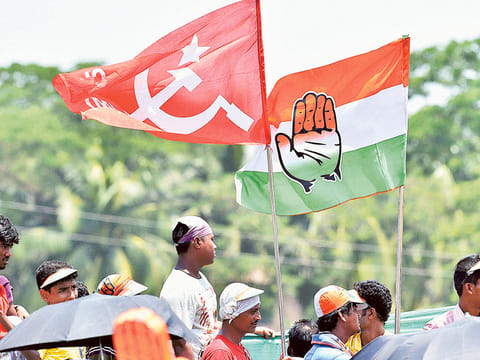 CPI(M) and Congress party supporters wave flags at Rahul Gandhi’s election rally in Howrah district on the eve of 2016 Assembly elections.