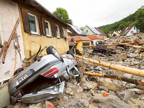 People look at the damage caused by the floods in Braunsbach, Germany.
