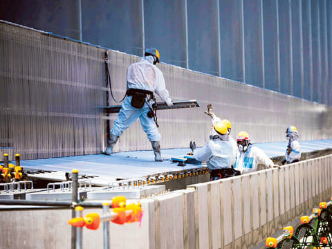File picture: Workers at the Fukushima Daiichi Nuclear Power Station.
