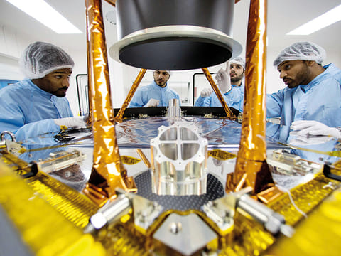 Mohammad Bin Rashid Space Centre engineers and scientists in a lab.