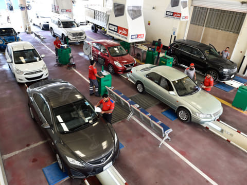 Vehicles being checked at a testing centre before the renewal of registration.