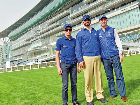 Godolphin's decorated trainers Saeed Bin Suroor (centre) and Charlie Appleby pose with jockey William Buick at Meydan.
