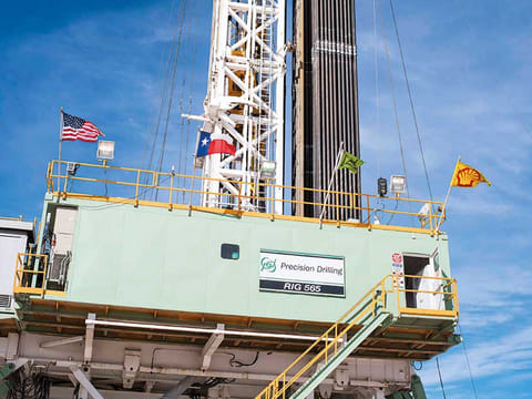 Flags fly from a Royal Dutch Shell oil rig in Texas. The American Petroleum Institute reported U.S. crude stockpiles rose by 3.86 million barrels in the past week.