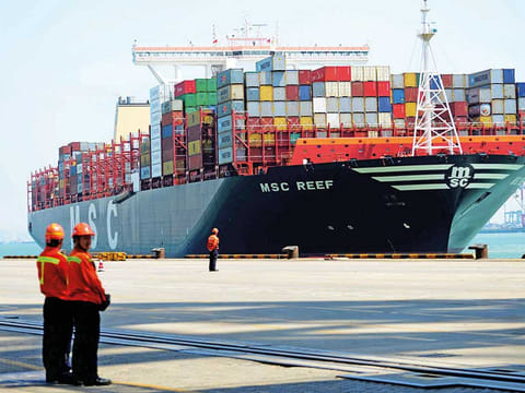 A container ship at Qingdao, east China. Maritime container freight shipping is steaming ahead through the Covid-19 pandemic, boosted by strong demand for Chinese exports and a shortage of vessels.