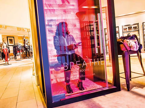 It's all experiences now - a shopper gets a feel of Breathe salt rooms at The Wellery on the second floor of the Saks Fifth Avenue flagship store in New York.