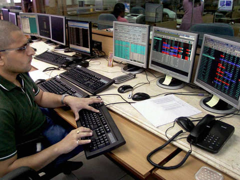 A broker seen at the National Stock Exchange in Mumbai.  While analysts largely warn that damage from social distancing will last for longer in most virus-ravaged emerging markets, some see this as an opportune time to start investing in them.