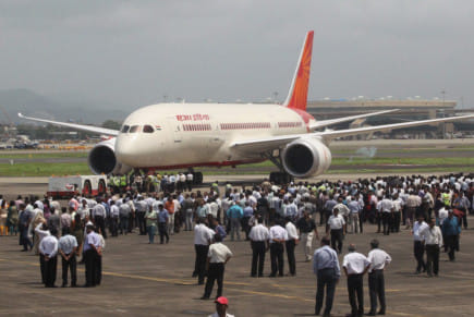 [File picture] Employees gather around a newly acquired Air India B-787 Dreamliner in 2012. The decision to allow FDI into the flag carrier was taken by the Union cabinet at a meeting.