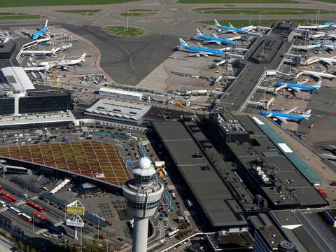 Passenger caps will again be introduced at Amsterdam's Schiphol Airport in April and May as it continues its recruitment drive.