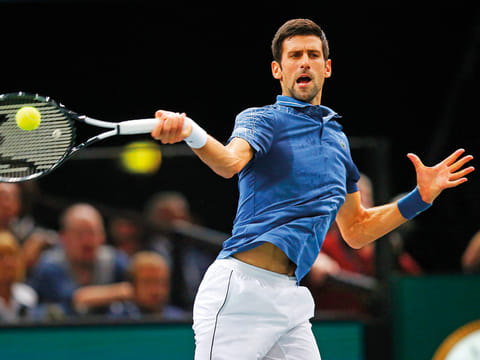 Novak Djokovic returns the ball to Karen Khachanov of Russia during their final match of the Paris Masters tennis tournament at the Bercy Arena in Paris, on November 4, 2018. 
