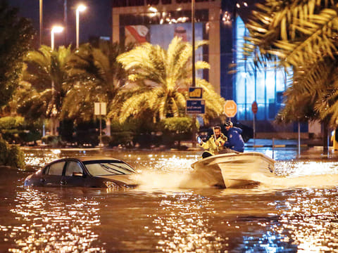 A boat on the flooded main road of the Daeya area of Kuwait City late on Wednesday. 