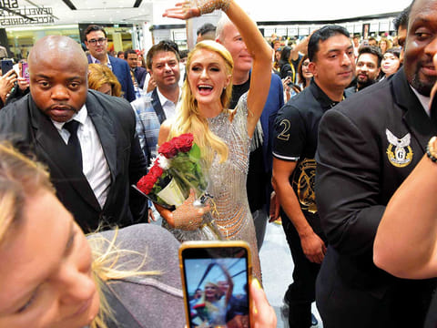 Paris Hilton greets fans as she launched her 24th perfume at Brands 4U in Dubai.