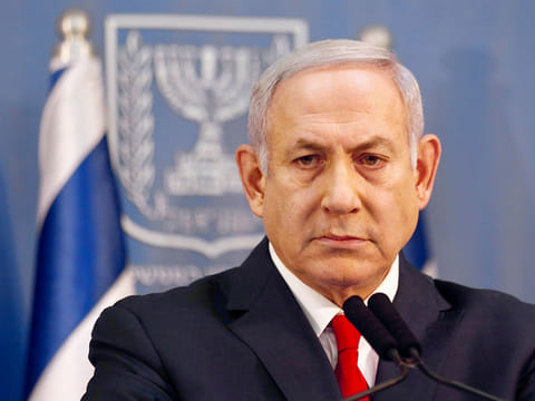 Israeli Prime Minister Benjamin Netanyahu delivers a statement in Tel Aviv, Israel, Sunday, Nov. 18, 2018. 