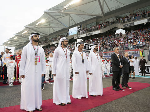 His Highness Shaikh Mohammad Bin Rashid Al Maktoum, Vice-President, Prime Minister of the UAE, Ruler of Dubai and Minister of Defence with Shaikh Hazza Bin Zayed Al Nahyan, Vice Chairman of the Abu Dhabi Executive Council; Jean Todt, President of the Federation International Automobile; Chase Carey, Chairman & CEO of the Formula One Group; Shaikh Hamdan Bin Mohammad Al Maktoum, Crown Prince of Dubai (fifth from right); and Shaikh Mansour Bin Mohammad Bin Rashid Al Maktoum at the final race of the 2018 Formula 1 Etihad Airways Abu Dhabi Grand Prix..