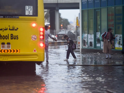 A student boards a school bus after schools cancelled classes on Monday due to heavy rains. 