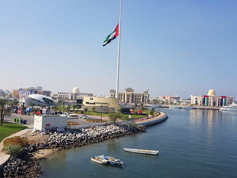 UAE Flag is hoisted half mast on the occasion of the Commemoration Day at the Sharjah Flag Island. 
