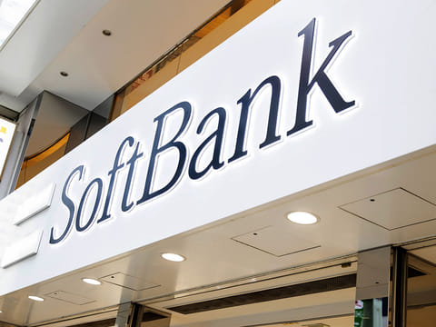 Signage for SoftBank Group Corp. is displayed outside one of the company's stores in Tokyo, Japan.