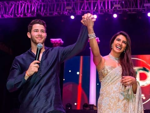 Bollywood actress Priyanka Chopra, right and Nick Jonas during a ceremony before their wedding, at Umaid Bhawan in Jodhpur, India