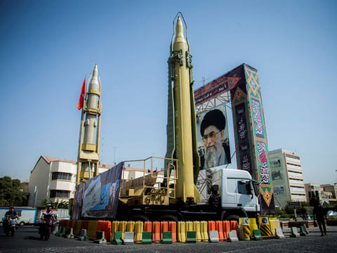 A display featuring missiles and a portrait of Iran's Supreme Leader Ayatollah Ali Khamenei is seen at Baharestan Square in Tehran, Iran 