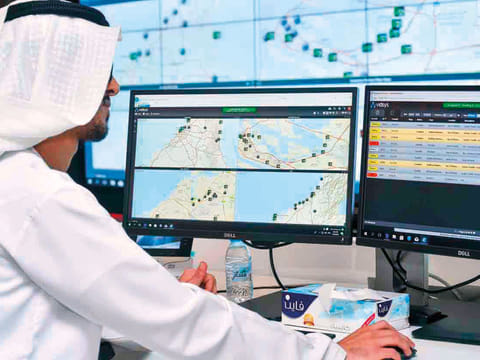 An officer monitors for fire alerts on his screen at the operation centre of Hassantuk. 