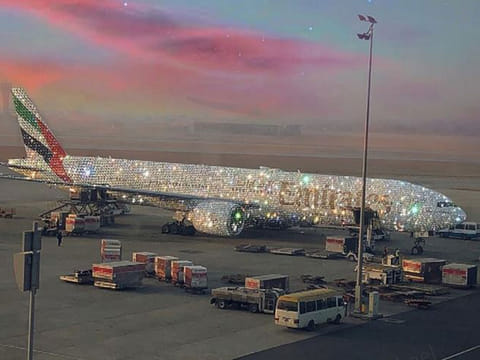 An Emirates plane is covered in diamonds.