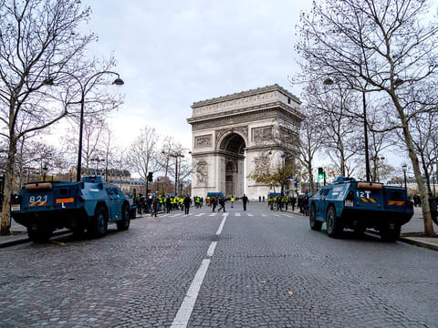 Gendarmerie armored vehicles (VBRG) sit parked near the Arc de Triomph during a yellow vests (Gilets jaunes) protest in Paris, France, on Saturday, Dec. 8, 2018.