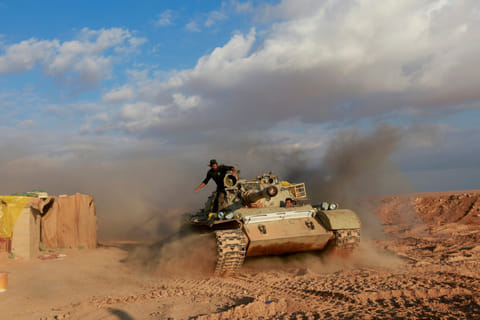 On Iraq-Syria border, pro-Iran militia eyes US forces