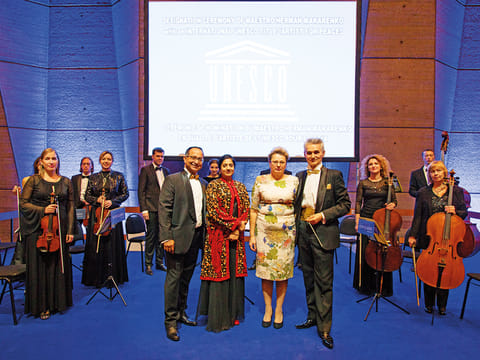 Suvra Chakraborty (left) and Herman Makerendo with the award-winning Kyiv Classic Orchestra. 