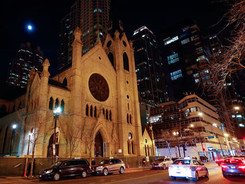 Cars drive past the Holy Name Cathedral in Chicago on December 19, 2018.  Almost 700 clergy in Illinois have been accused of child sexual assault, a far greater number than the Catholic Church had previously disclosed, the US state's top prosecutor revealed on December 19. 