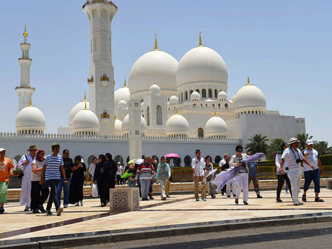 Tourists visit the Shaikh Zayed Grand Mosque in Abu Dhabi.