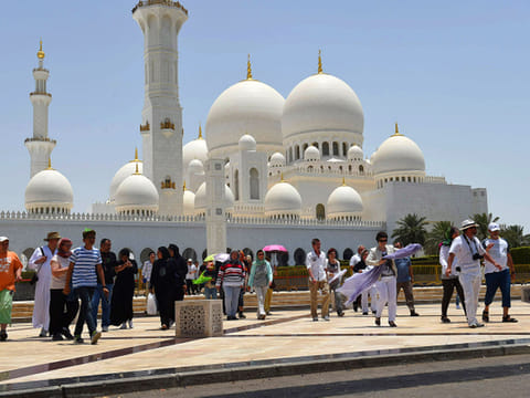 Tourists visit the Shaikh Zayed Grand Mosque in Abu Dhabi.