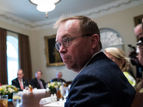 Office of Management and Budget Director Mick Mulvaney, now the acting White House chief of staff, listens as President Donald Trump speaks during a lunch with members of Congress at the White House in June 2018. 