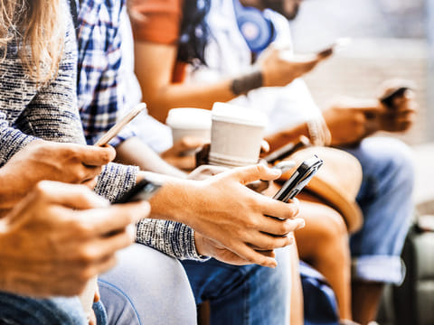 People using their mobile phones