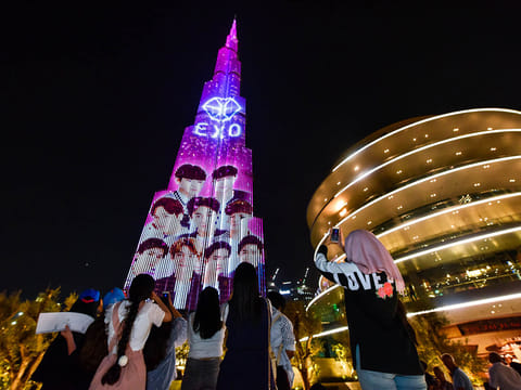 Fans gathered near Dubai Mall fountain to watch the EXO band song displayed on Burj Khalifah. 1St 4th July 2018.