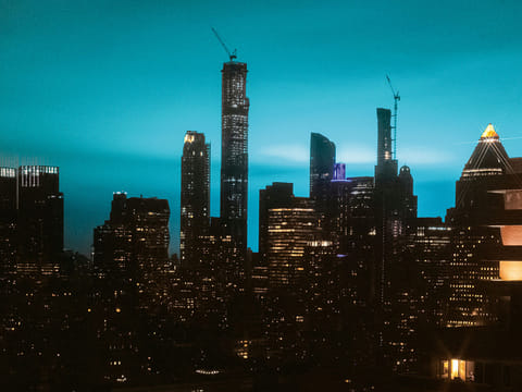 The night sky is illuminated by blue light in New York. The US has officially logged 1,745,606 overall cases of the virus.