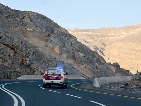 Ras Al Khaimah Police patrol the road leading to Jebel Jais mountain on Sunday following the helicopter crash.