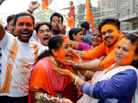 Supporters of India's ruling Bharatiya Janata Party (BJP) celebrate after learning of the initial poll results of 2018 Tripura state assembly elections, in Agartala, on March 3, 2018. This time, the BJP faces a Left-Congress alliance and a third player who will be key — the TIPRA Motha party.