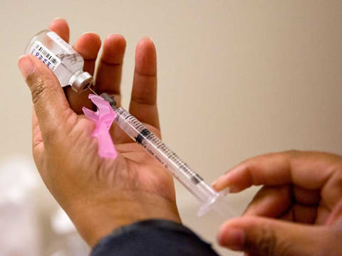 File picture: A nurse prepares a flu shot at the Salvation Army in Atlanta. 