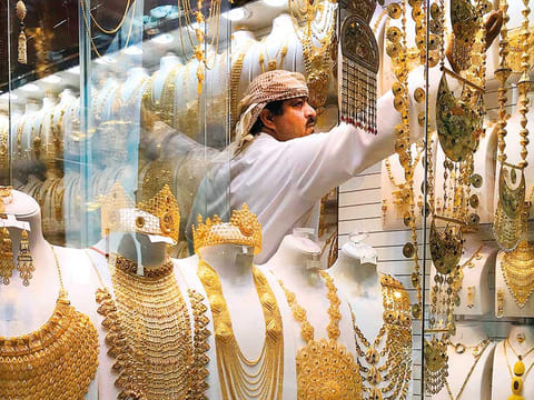 A man in a gold shop. 