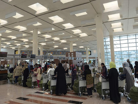 File photo shows passengers waiting in queue at an international counter during a rehearsal by the airport officials at the newly-built Islamabad International Airport.