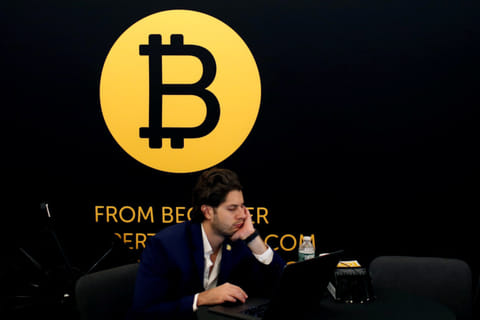 The Bitcoin logo at a Blockchain conference in New York. Picture used for illustrative purposes.