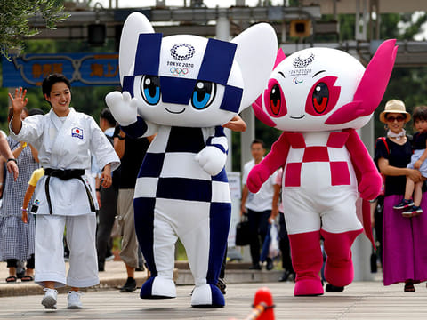Tokyo 2020 Olympics mascot Miraitowa (centre) and Paralympic mascot Someity being paraded on the streets of Tokyo. 